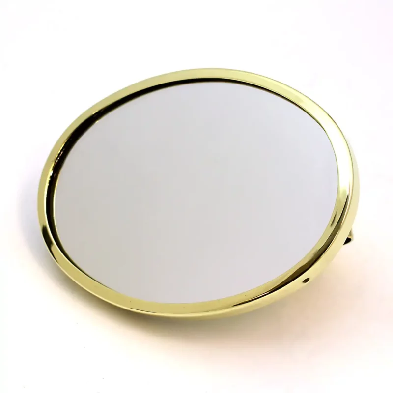 image of an Oval shaped vintage rear view mirror head in brass