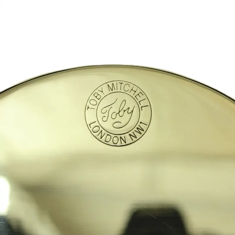 Image of Tall Oval vintage rear view mirror brass back detail of TOBY logo
